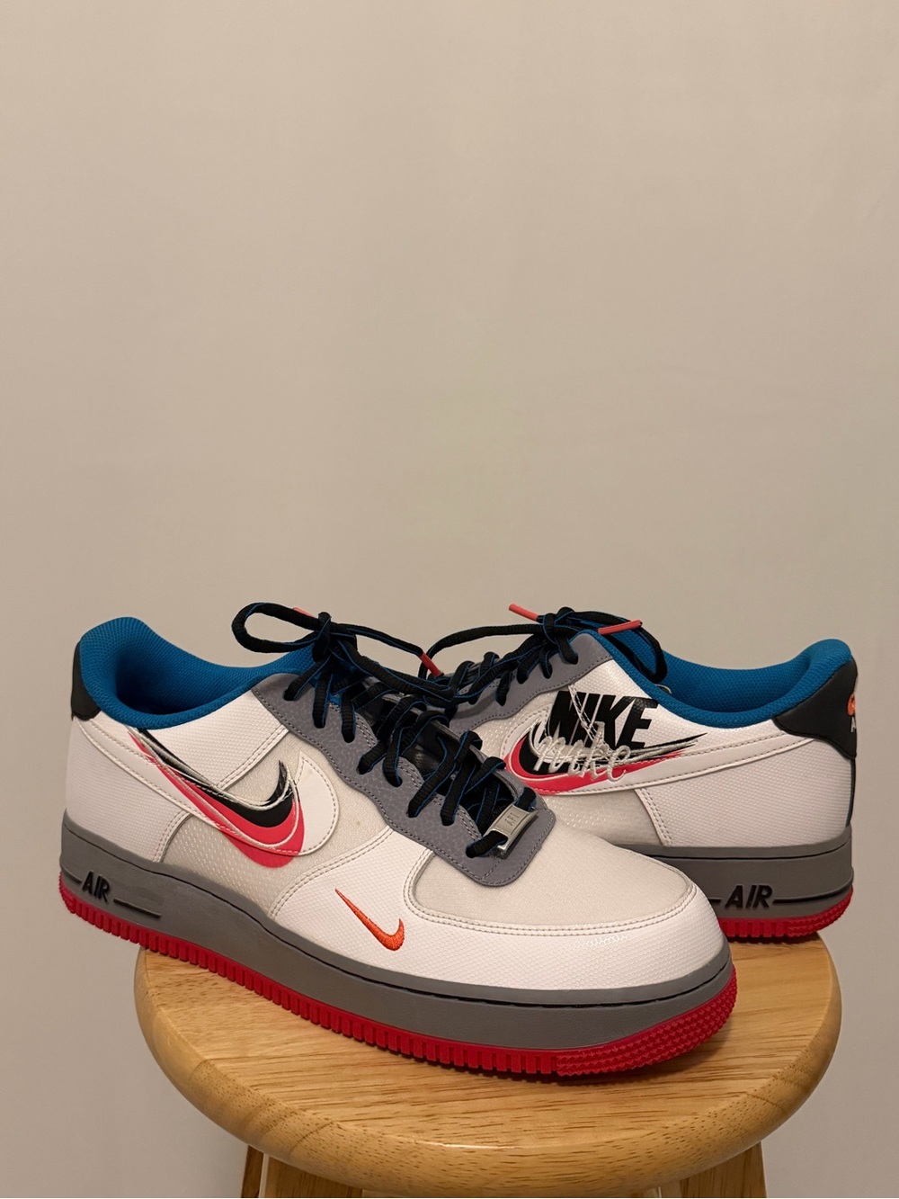Nike Men’s White Sneakers with Red, Orange & Blue Accents